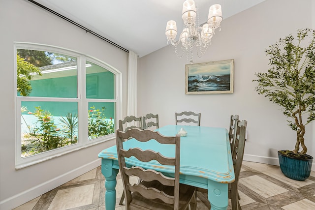 dining space with a wealth of natural light and an inviting chandelier