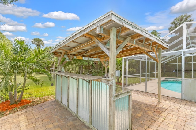 view of patio / terrace featuring glass enclosure