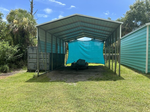 view of parking with a yard and a carport