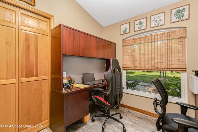 office space with vaulted ceiling