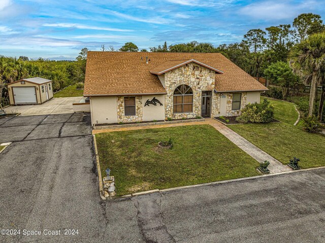 single story home featuring a front lawn