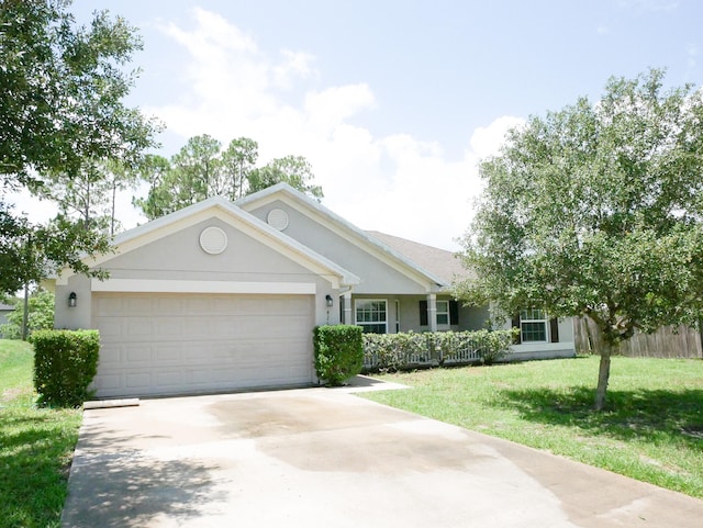 single story home featuring a garage and a front yard