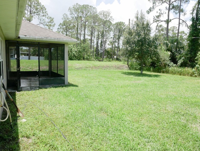 view of yard with a sunroom