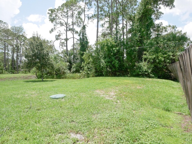 view of yard with fence