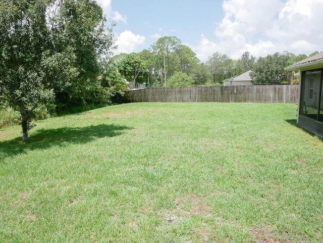 view of yard featuring a fenced backyard