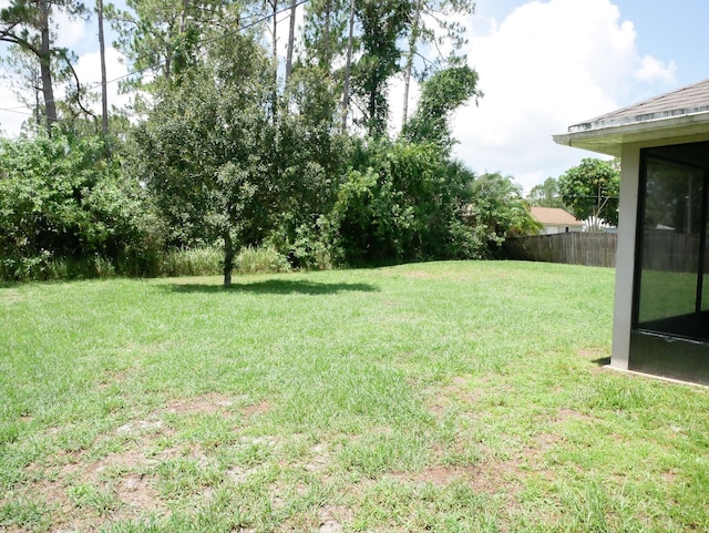 view of yard with fence