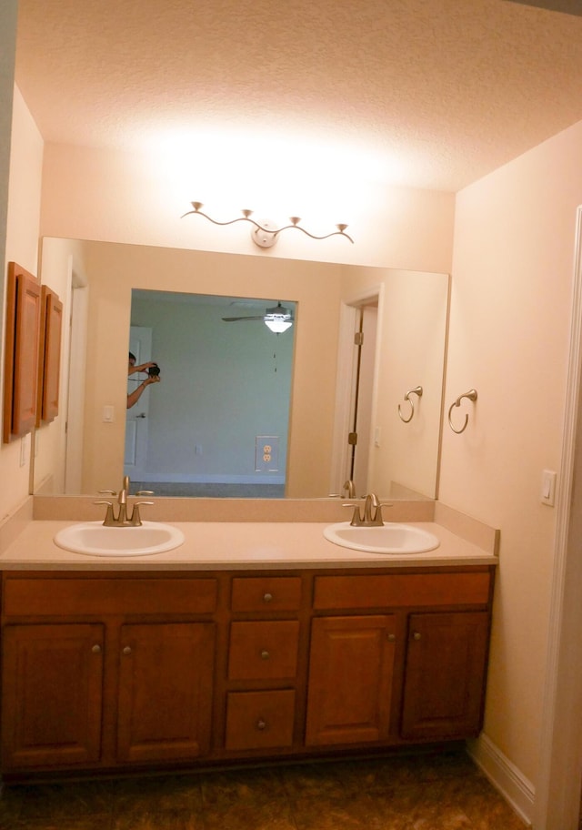 full bath with a sink and double vanity