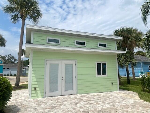 rear view of property with a patio and french doors