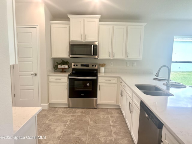 858 Soleway Dr, Palm Bay, FL 32907 - kitchen featuring appliances with stainless steel finishes, a sink, and white cabinetry