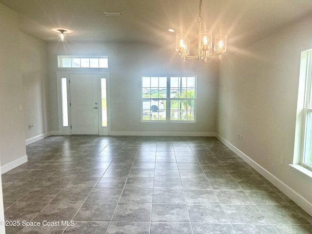 858 Soleway Dr, Palm Bay, FL 32907 - entryway featuring a chandelier, plenty of natural light, and baseboards