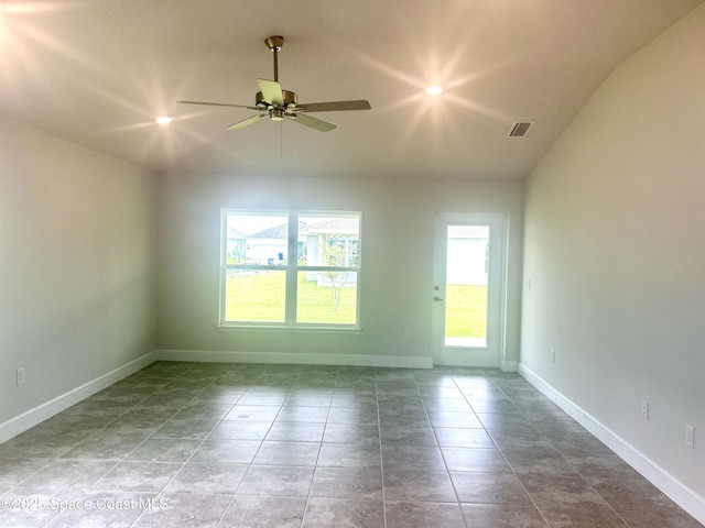 858 Soleway Dr, Palm Bay, FL 32907 - tiled empty room featuring lofted ceiling, a ceiling fan, and baseboards