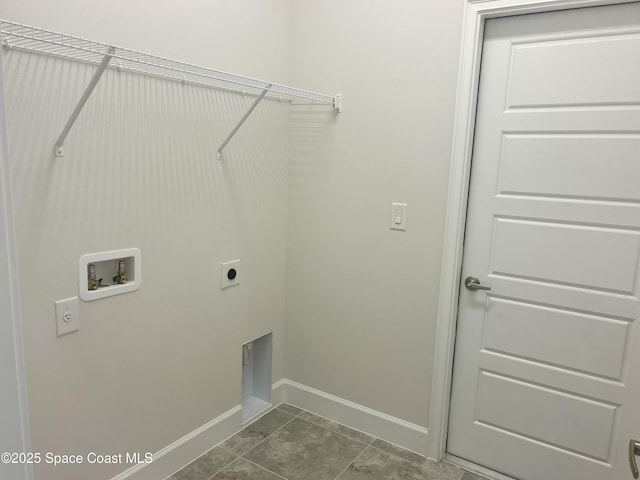 858 Soleway Dr, Palm Bay, FL 32907 - laundry area featuring hookup for an electric dryer, hookup for a washing machine, baseboards, and dark tile patterned floors