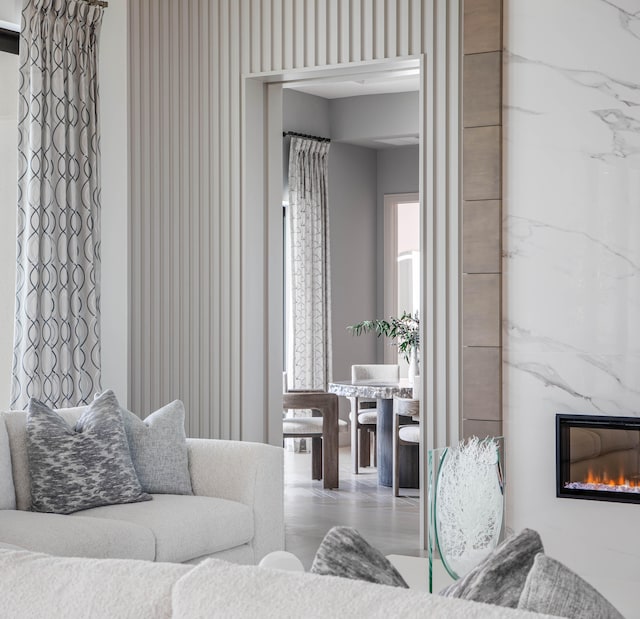 living room with hardwood / wood-style flooring and a fireplace