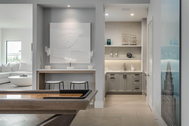 interior space with sink and light parquet flooring