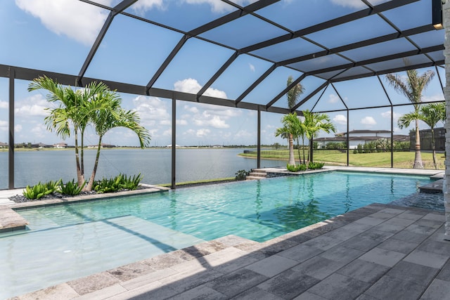 view of pool with a patio area and a lanai