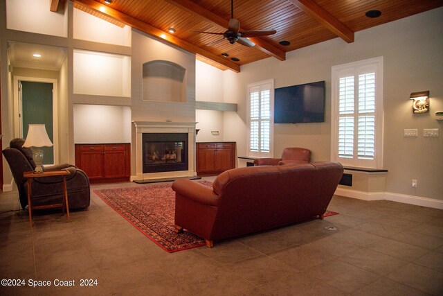 living room with high vaulted ceiling, wood ceiling, beam ceiling, and ceiling fan