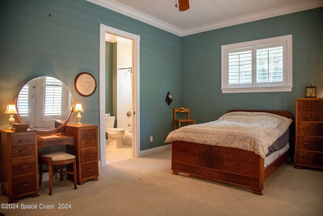 bedroom featuring ensuite bath, multiple windows, light carpet, and ceiling fan