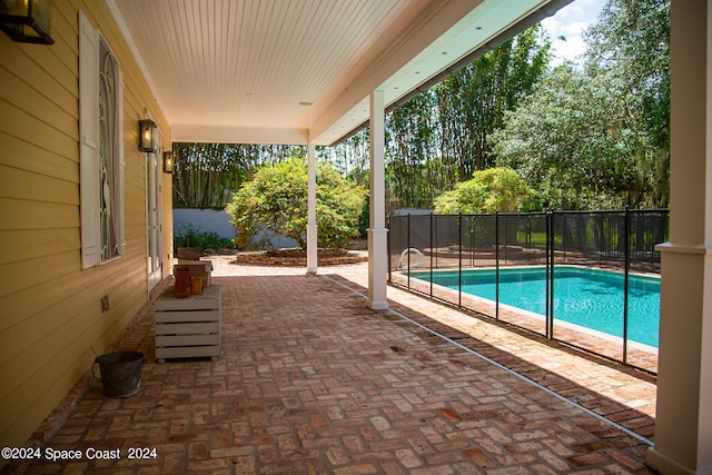 view of swimming pool featuring a patio area