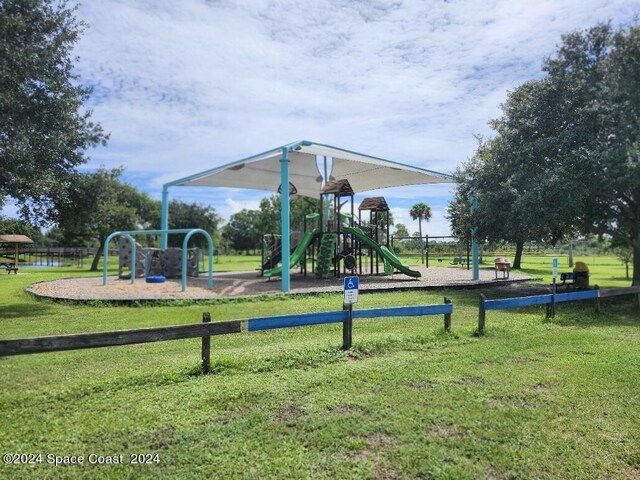 view of play area with a yard