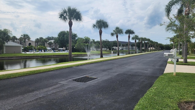 view of street with a water view and sidewalks