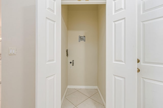 interior space with light tile patterned flooring and baseboards