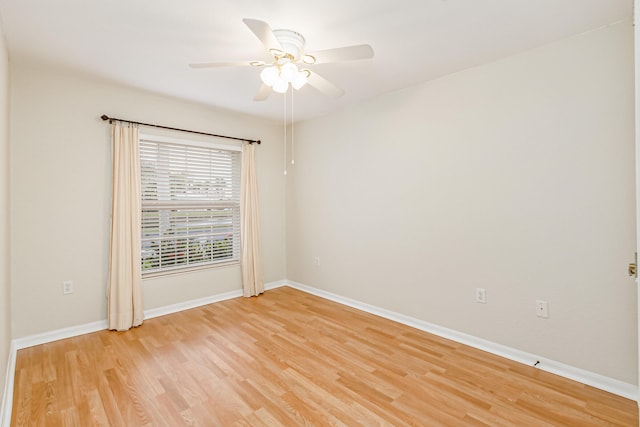 spare room featuring ceiling fan and light hardwood / wood-style flooring