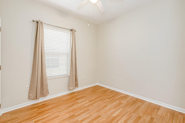 empty room featuring ceiling fan and hardwood / wood-style flooring