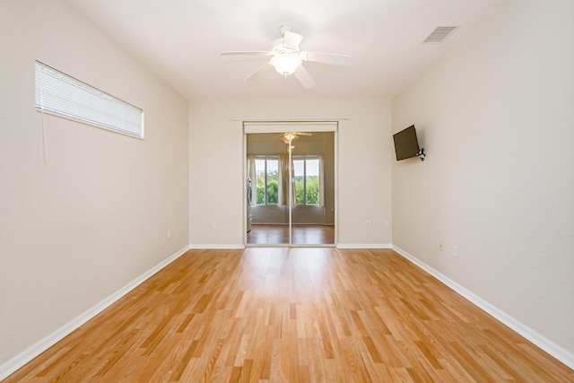 unfurnished room featuring ceiling fan and light hardwood / wood-style floors