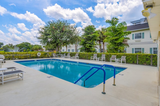 view of swimming pool with a patio area