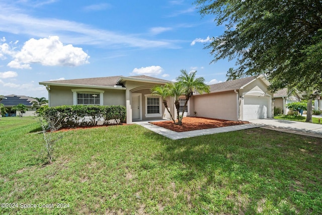 single story home featuring a garage and a front lawn