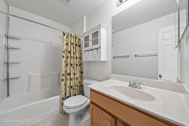 full bathroom with toilet, tile patterned flooring, vanity, a textured ceiling, and shower / bath combo