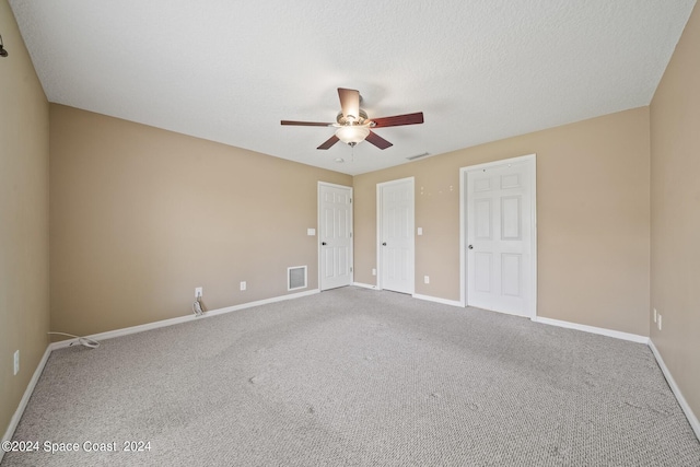 unfurnished bedroom featuring carpet flooring and ceiling fan