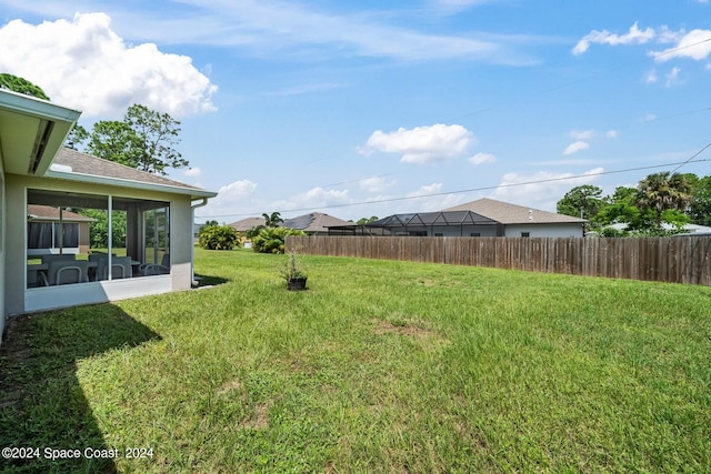 view of yard with a sunroom