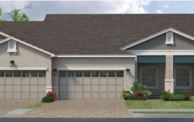 7794 Cache Creek Ln, Melbourne, FL 32940 - view of front facade featuring stucco siding, a shingled roof, a garage, and decorative driveway