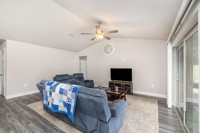 living room featuring ceiling fan, dark hardwood / wood-style flooring, and vaulted ceiling