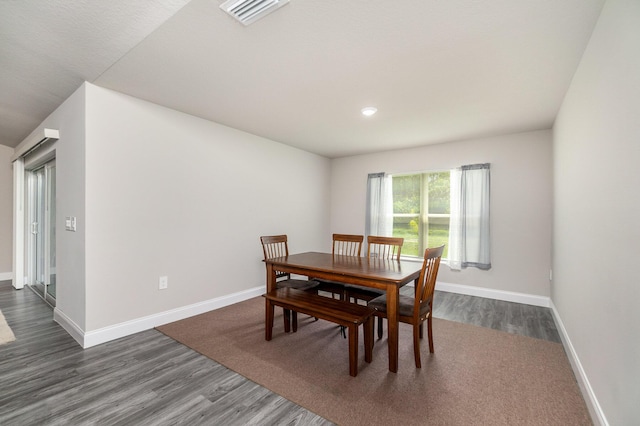 dining area featuring dark hardwood / wood-style floors