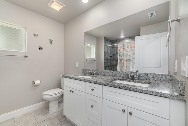 bathroom featuring vanity, tile patterned flooring, a shower with curtain, and toilet