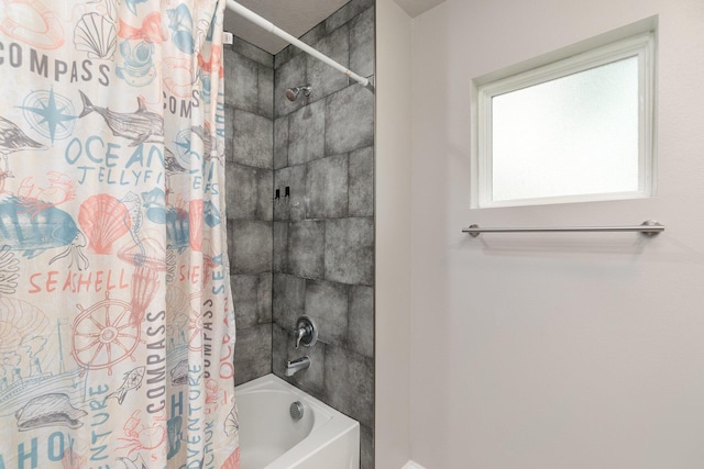 bathroom with shower / tub combo with curtain