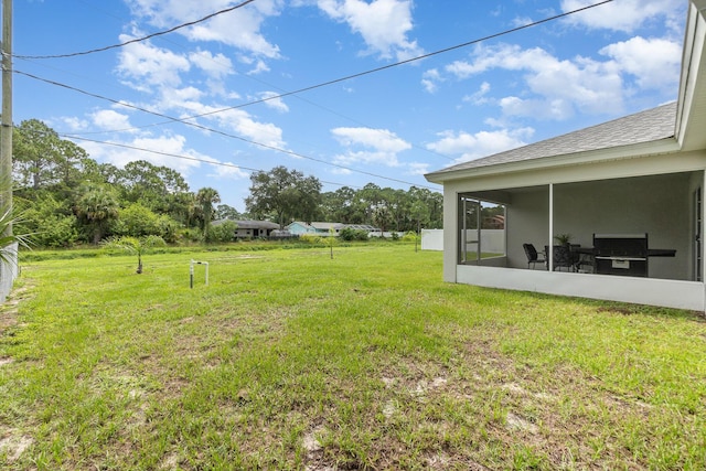 view of yard featuring a sunroom