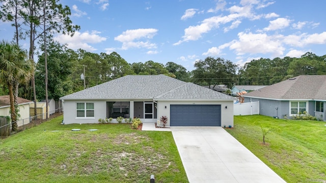 single story home featuring a garage and a front lawn