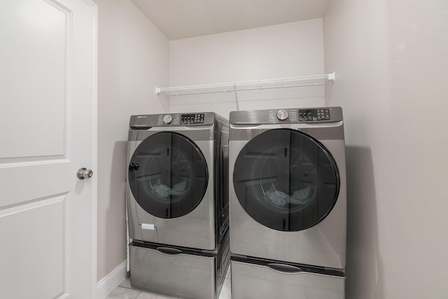 washroom with separate washer and dryer