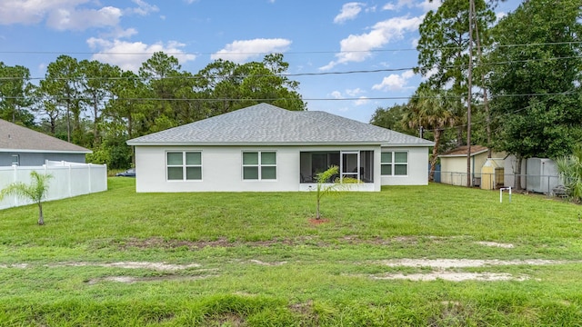 back of house with a yard