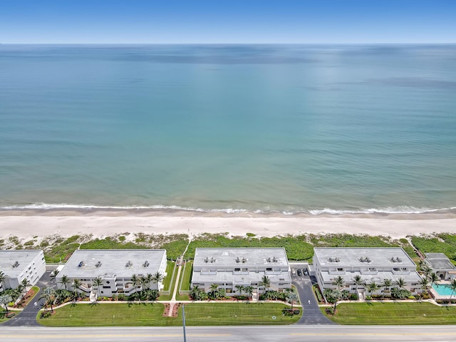 aerial view featuring a water view and a beach view