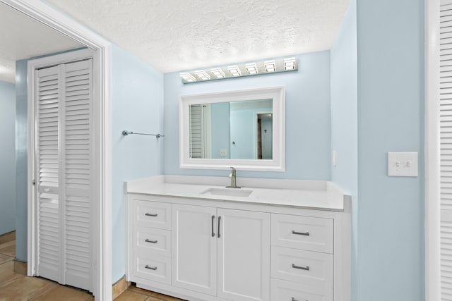 bathroom featuring vanity and a textured ceiling