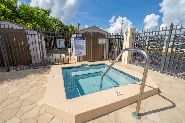 view of swimming pool featuring a community hot tub