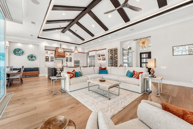 living room featuring high vaulted ceiling, light wood-type flooring, and ceiling fan