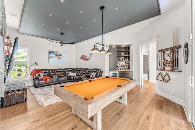 rec room featuring pool table, light hardwood / wood-style floors, and indoor bar