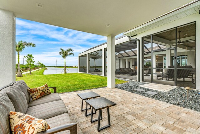 view of patio / terrace with an outdoor hangout area and a water view