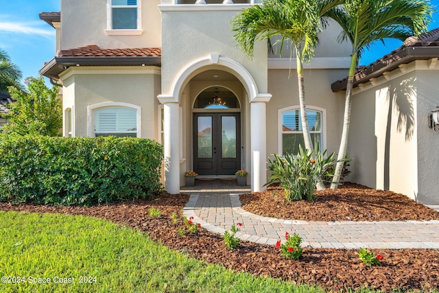 property entrance featuring french doors