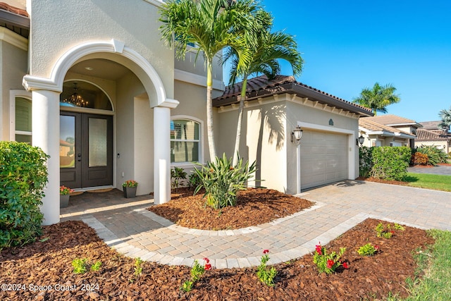 doorway to property featuring a garage